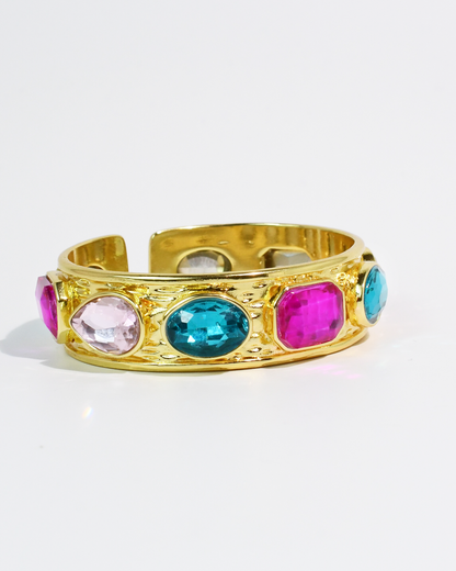 Multi Glow Bangle with gold cuff and vibrant pink, blue, and clear gemstones by TREASURE JEWELS
