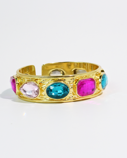 Multi Glow Bangle with gold cuff and vibrant pink, blue, and clear gemstones by TREASURE JEWELS