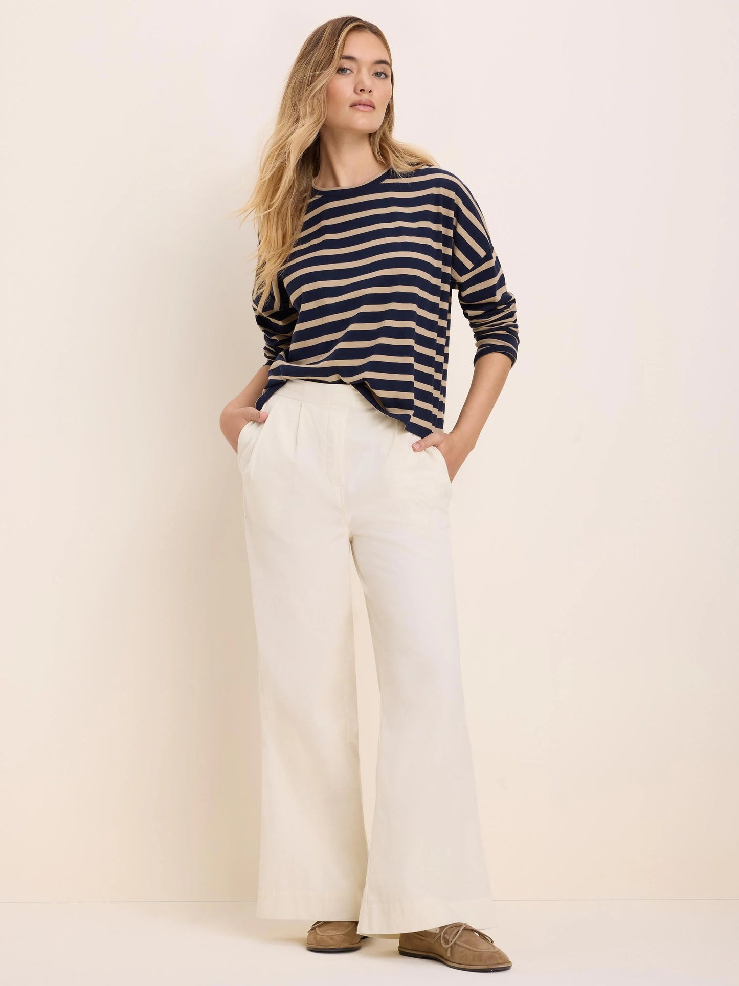 Soft Stripe Tee in navy and beige stripes styled with white wide-leg pants by NIC AND ZOE