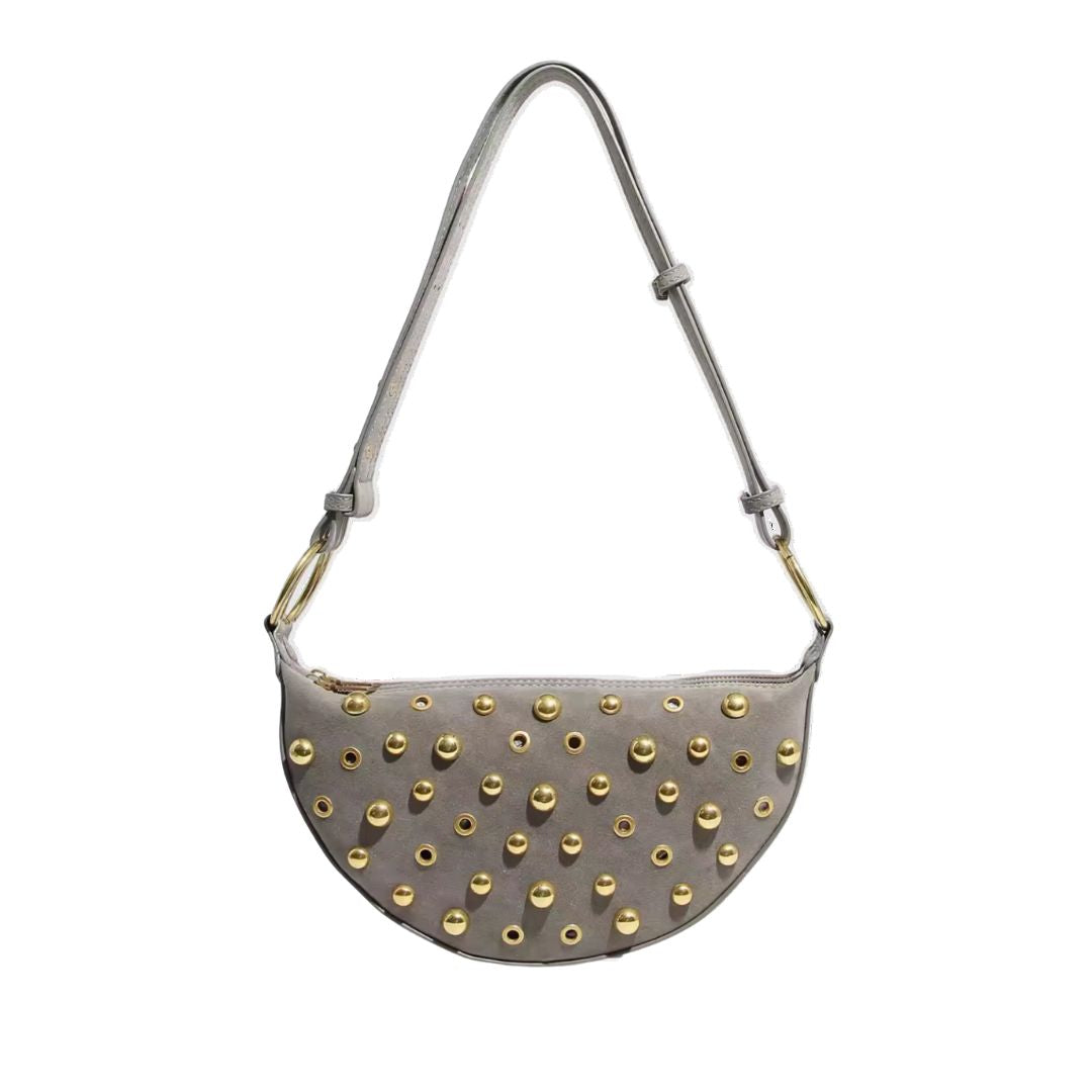 Maeve Studded Bag in gray with gold-tone eyelet studs and adjustable shoulder strap