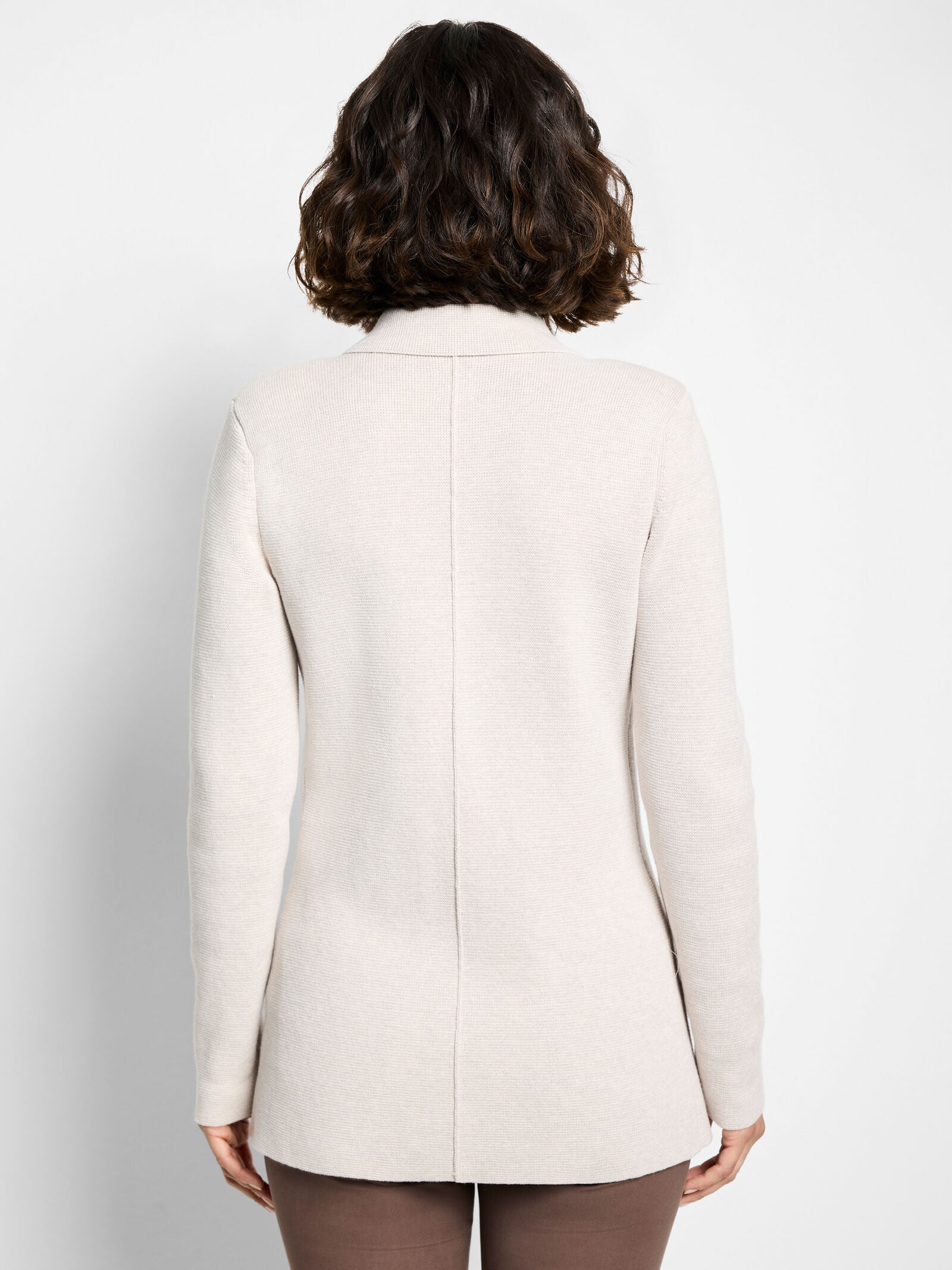 Back view of sugar cookie knit blazer with center seam and long sleeves