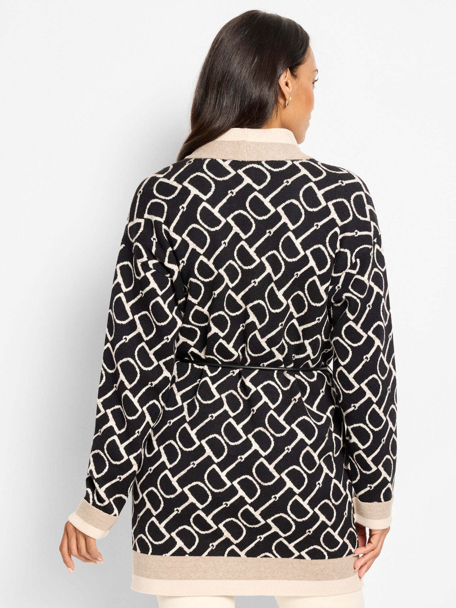 Back of belted equestrian jacket, black linked print with beige hem band