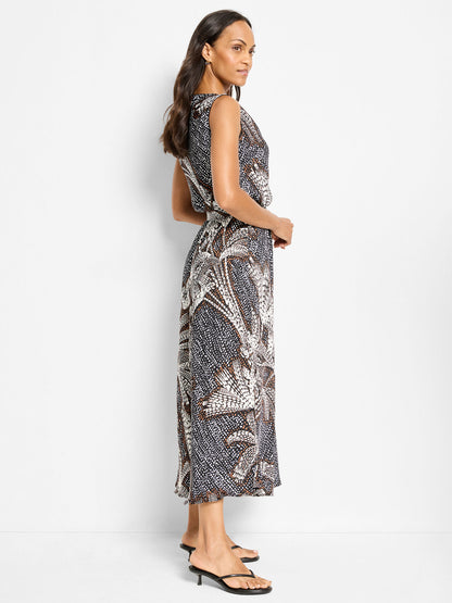 Black multi sleeveless midi dress, boat neckline, side profile with palm dot pattern