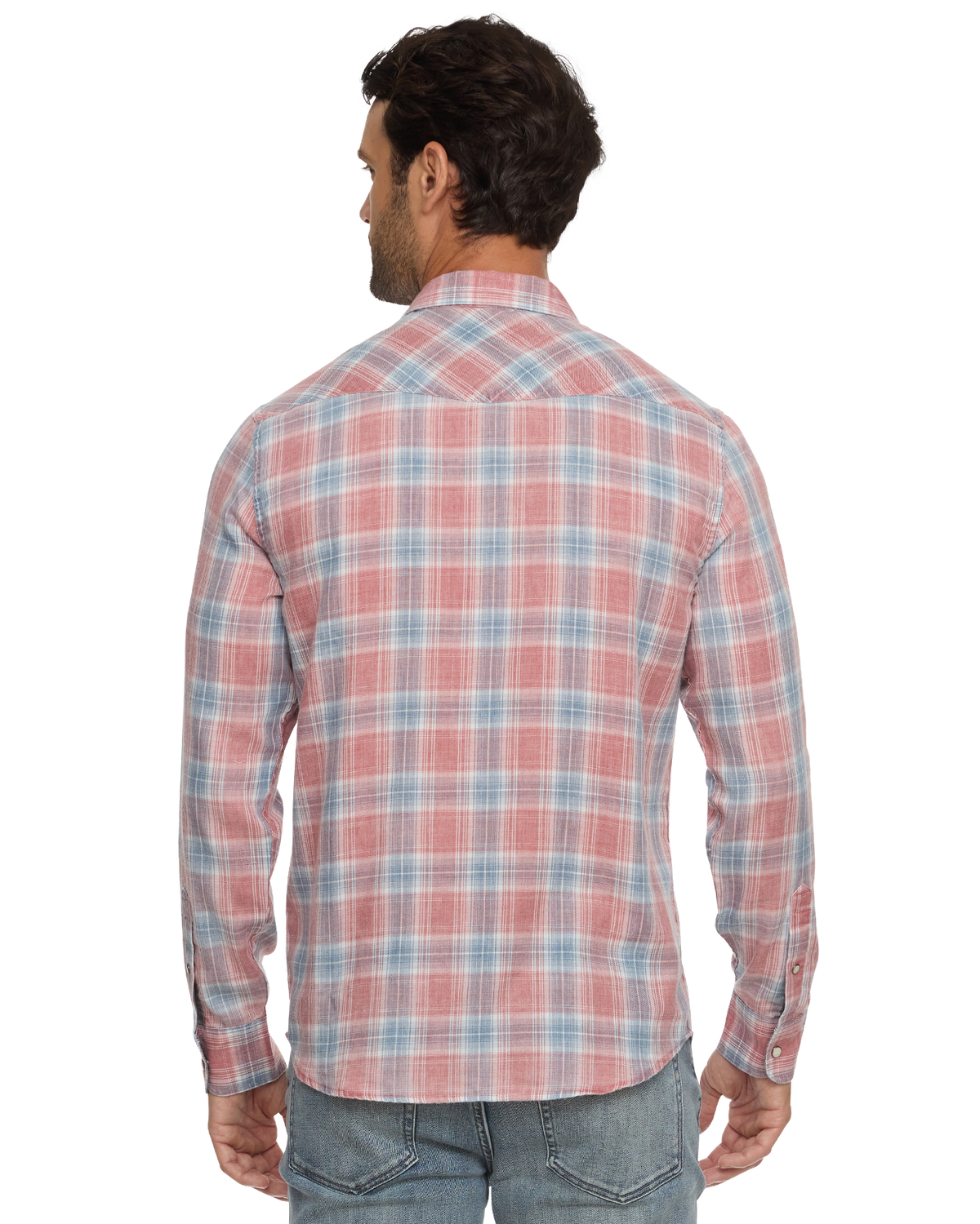 Man wearing a red and blue plaid button-up shirt, seen from behind