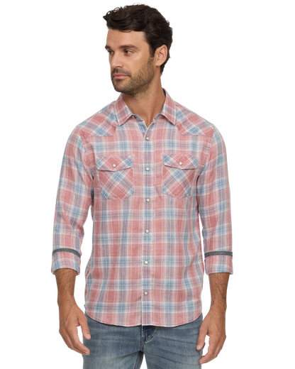 Man wearing a coral and blue plaid button-down shirt