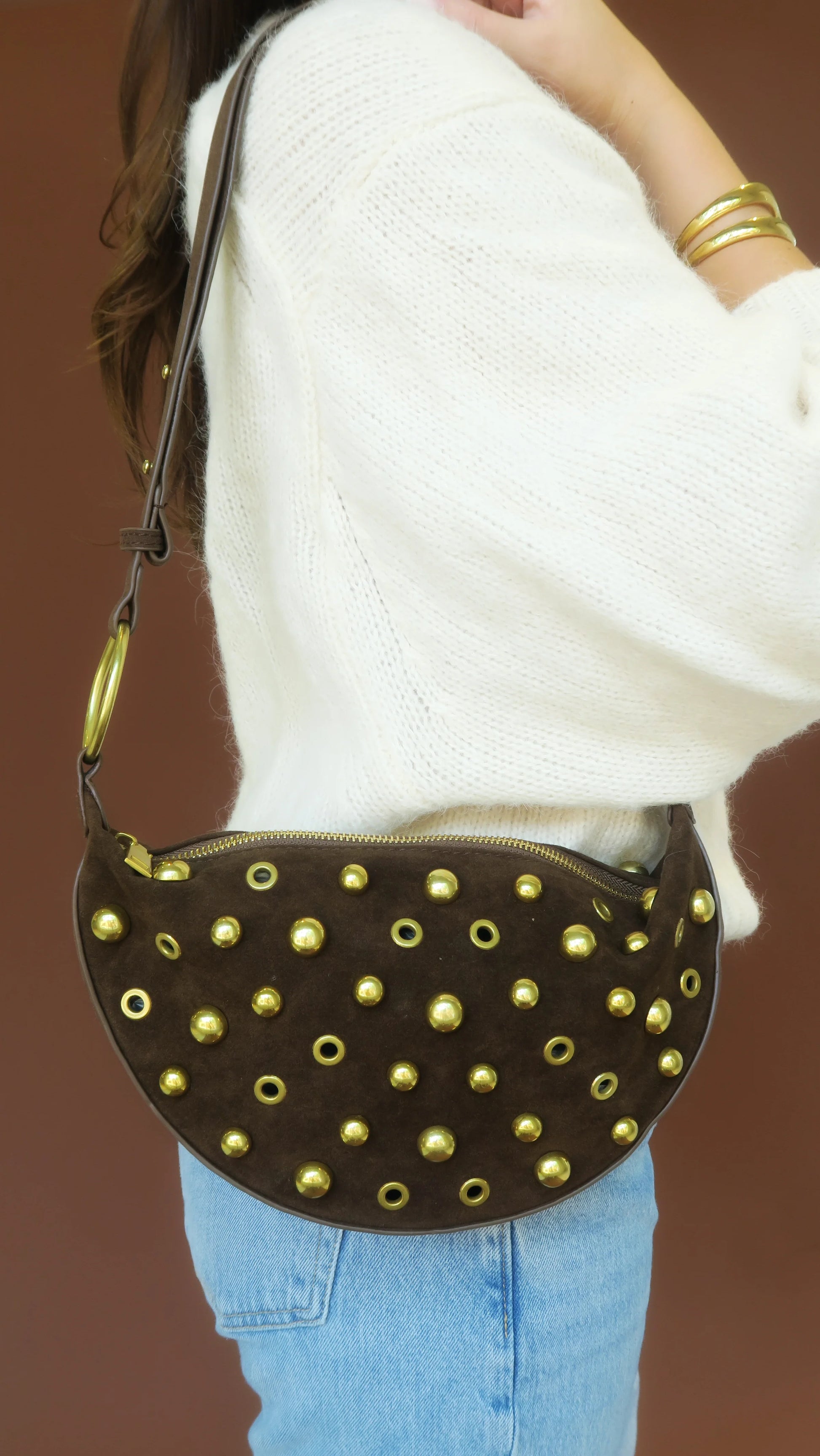 Maeve Studded Bag worn crossbody in dark olive/gray with gold-tone stud details