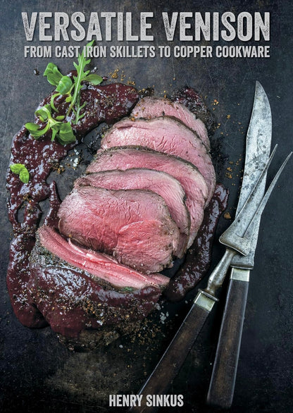 Sliced medium-rare venison steak on a dark surface, garnished with greens and accompanied by vintage carving knife and fork, showcasing Versatile Venison in artisanal style.