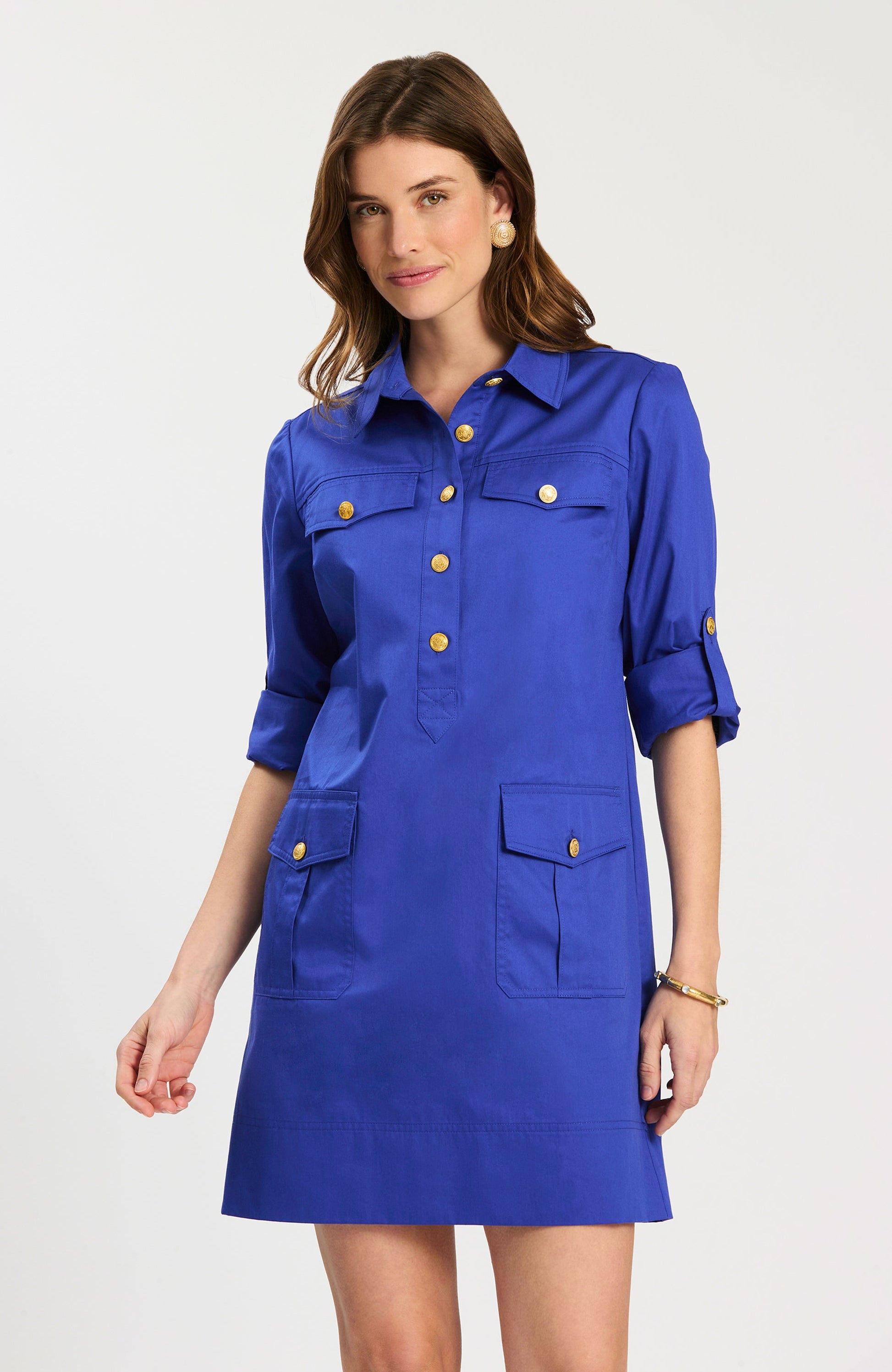 Rory Dress in vibrant blue with gold buttons and utility pockets, personally curated in Fredericksburg TX