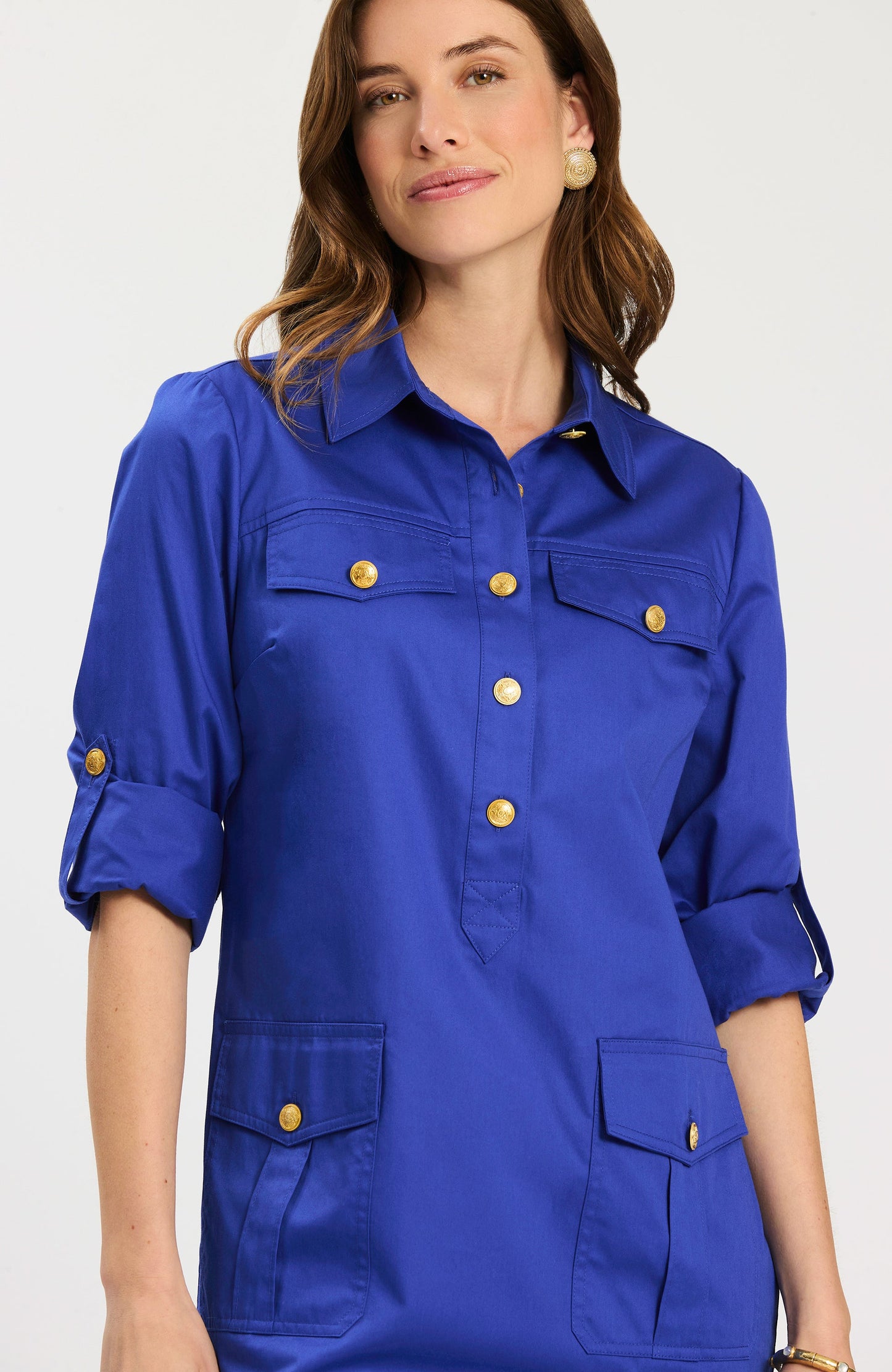 Rory Dress in vibrant blue with gold buttons and flap pockets, curated at HCO Fredericksburg TX