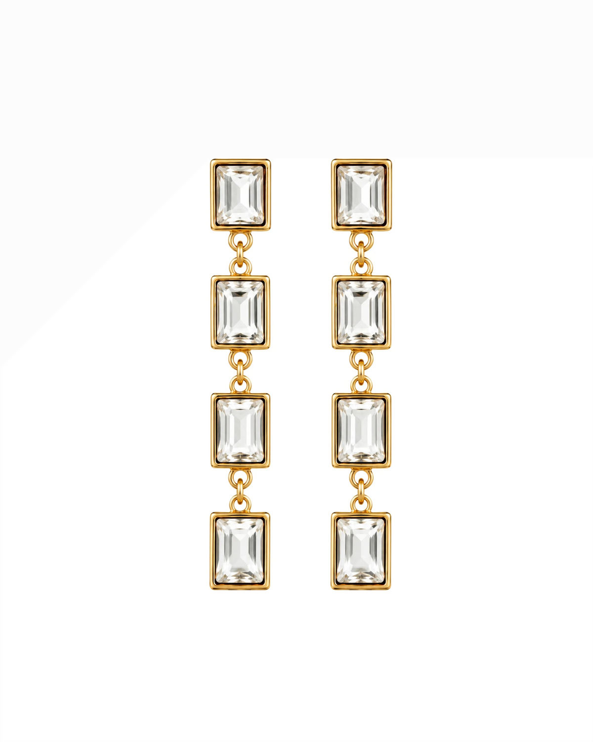 Gold-tone dangling earrings with four rectangular clear stones each