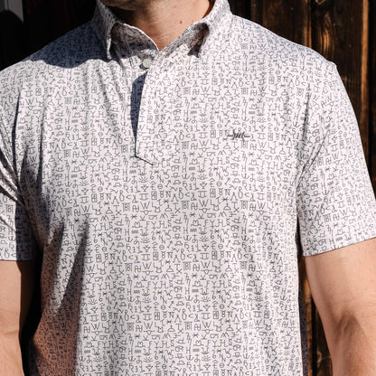 Ash Traditional Polo front view, buttoned placket and repeating logo print