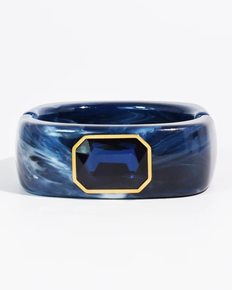 The Gemma Cuff Bracelet by TREASURE JEWELS with marbled Navy resin and emerald cut crystal