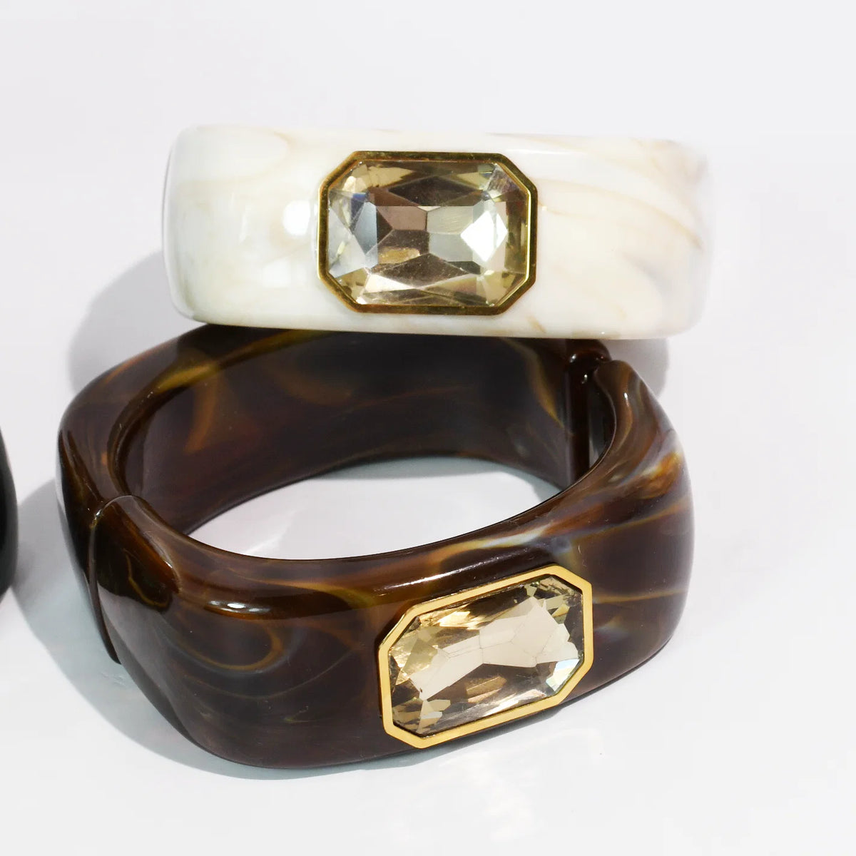 The Gemma Cuff Bracelet from TREASURE JEWELS with marbled resin and gold bezel crystal