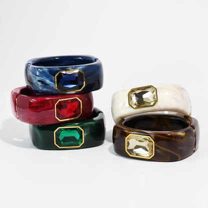 The Gemma Cuff Bracelet by TREASURE JEWELS with marbled resin and emerald cut crystals