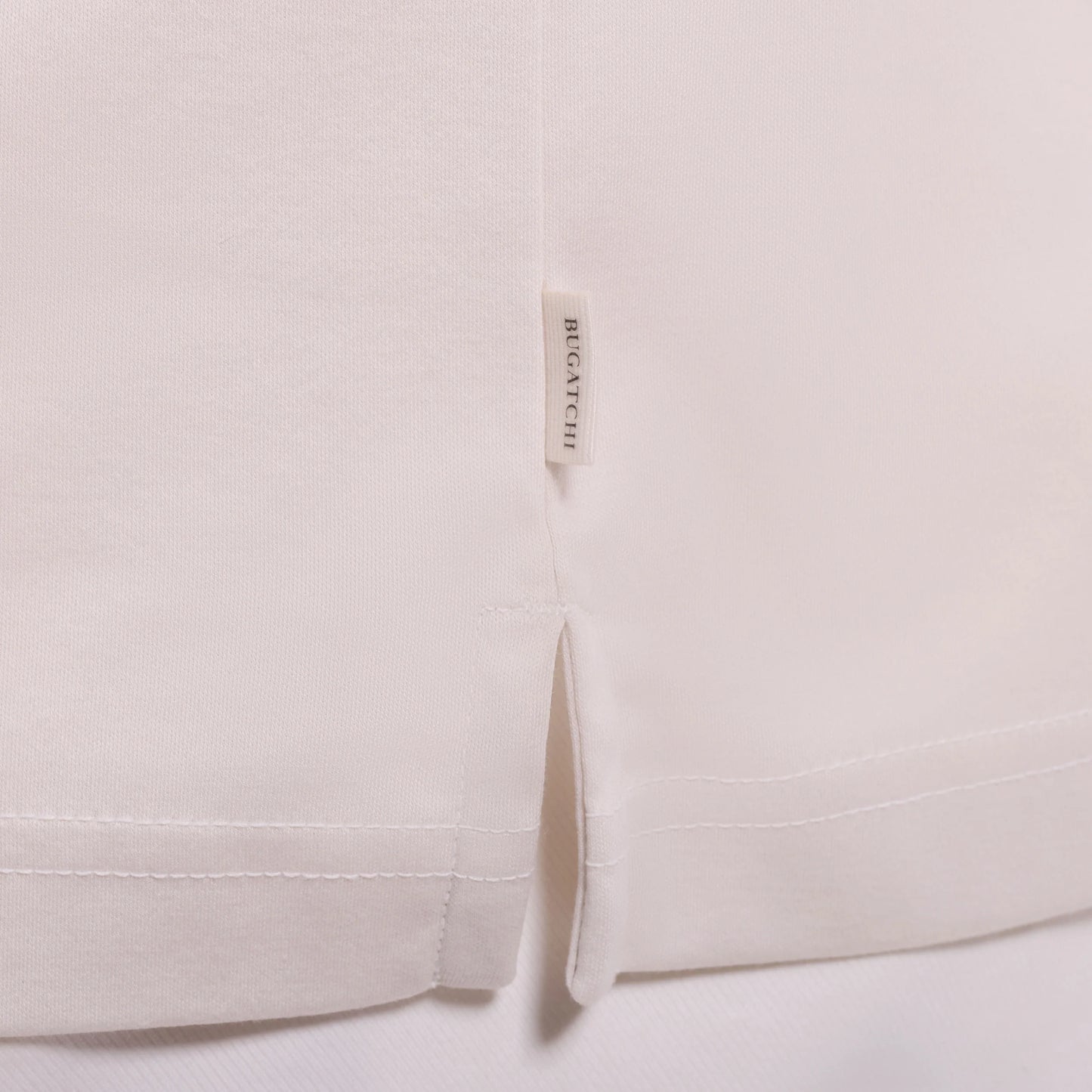 Solid Pima Johnny Collar Polo- Ivory with side vents and BUGATCHI label, men's short sleeve shirt