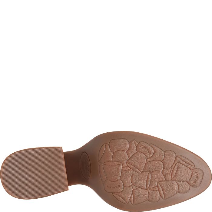 Brown boot outsole with textured tread and circular brand stamp