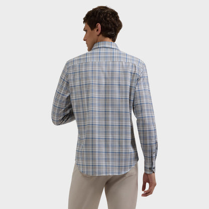 Man wearing a blue and gray plaid shirt with khaki pants, viewed from behind