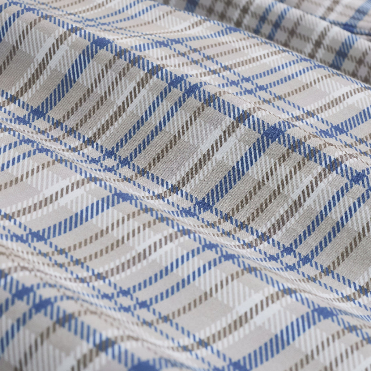 Blue gray and white plaid fabric in close detail