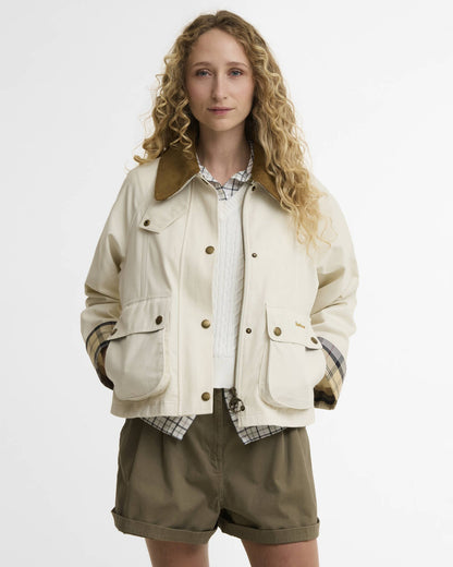 Cropped Beadnell Casual Jacket in beige cotton with cord collar and tartan cuffs styled casually