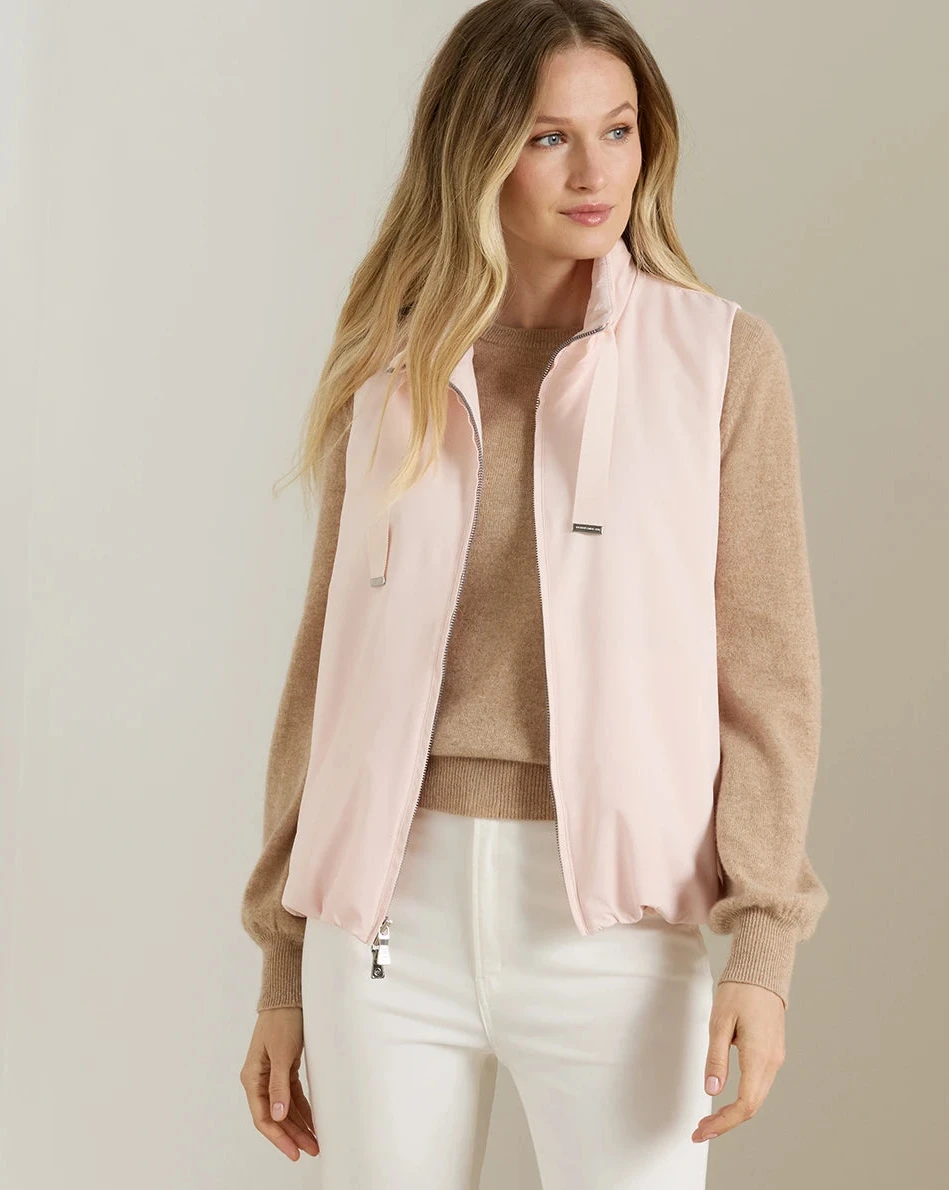 Woman wearing Robinson Air Vest in pink and beige by PETER MILLAR from HCO Women's Vests collection