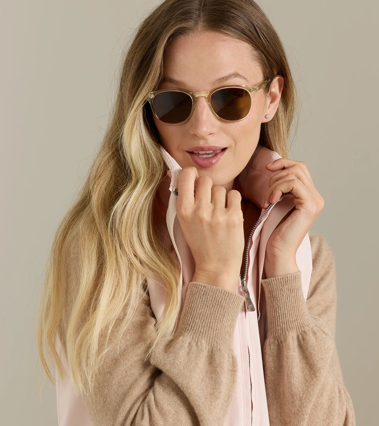 Woman wearing Robinson Air Vest in pink and beige by PETER MILLAR from HCO Fredericksburg
