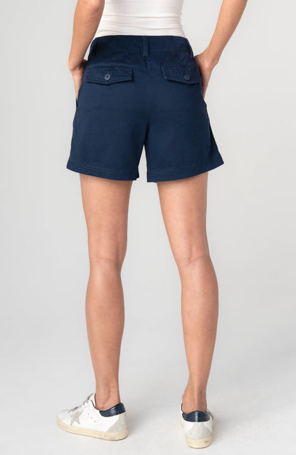 Pleated Trouser Short 5" in deep navy with buttoned back flap pockets, tailored relaxed fit