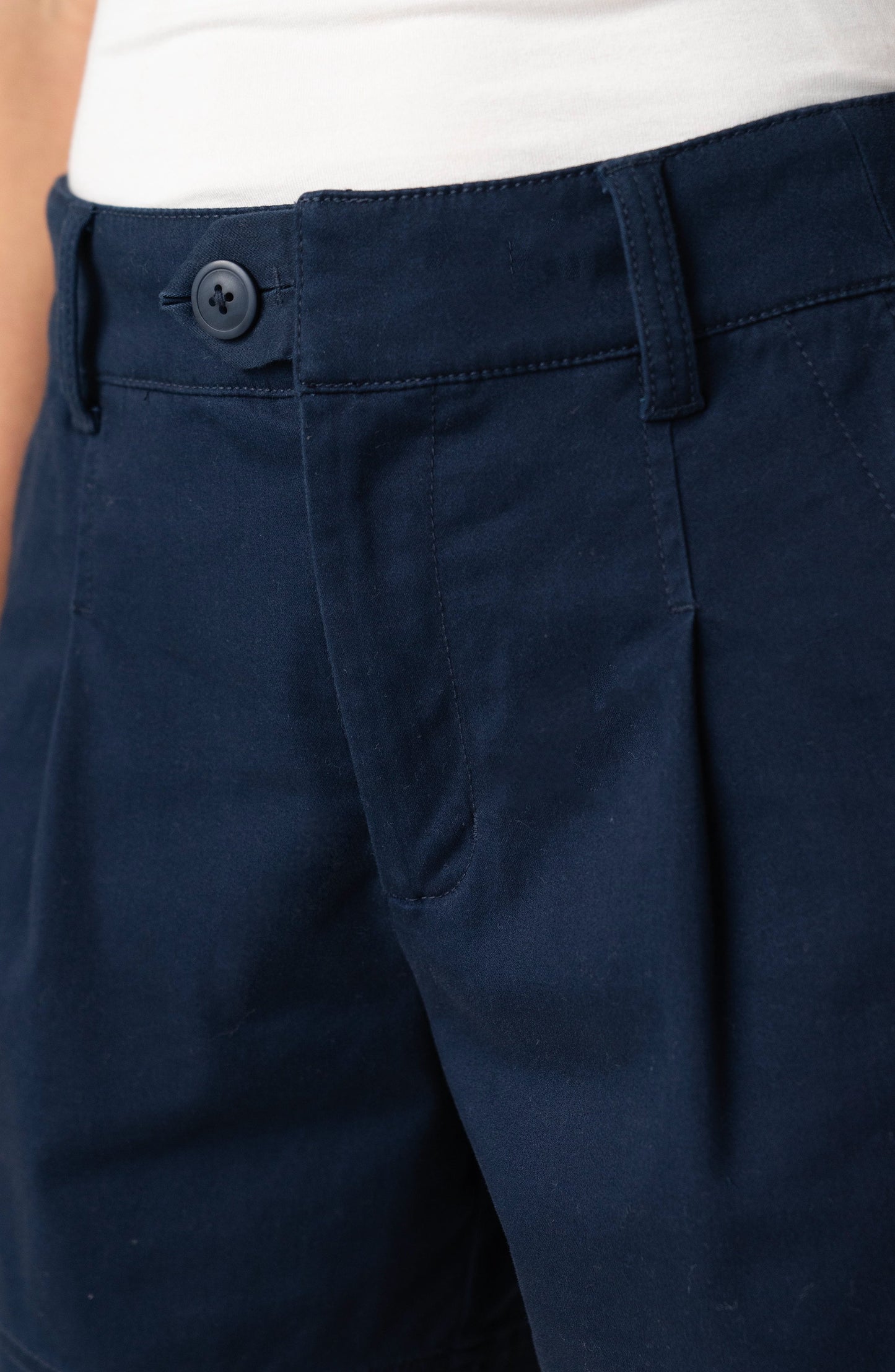 Pleated Trouser Short 5" in deep midnight navy with tailored pleats and button closure, curated TX style