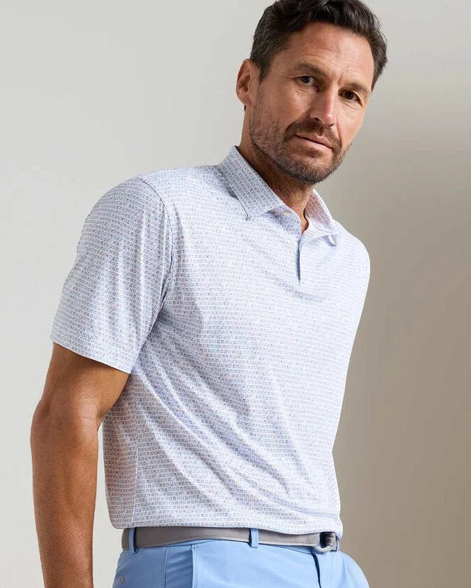 Featherweight Cornhole Performance Polo in white geometric pattern with stretch and UV protection