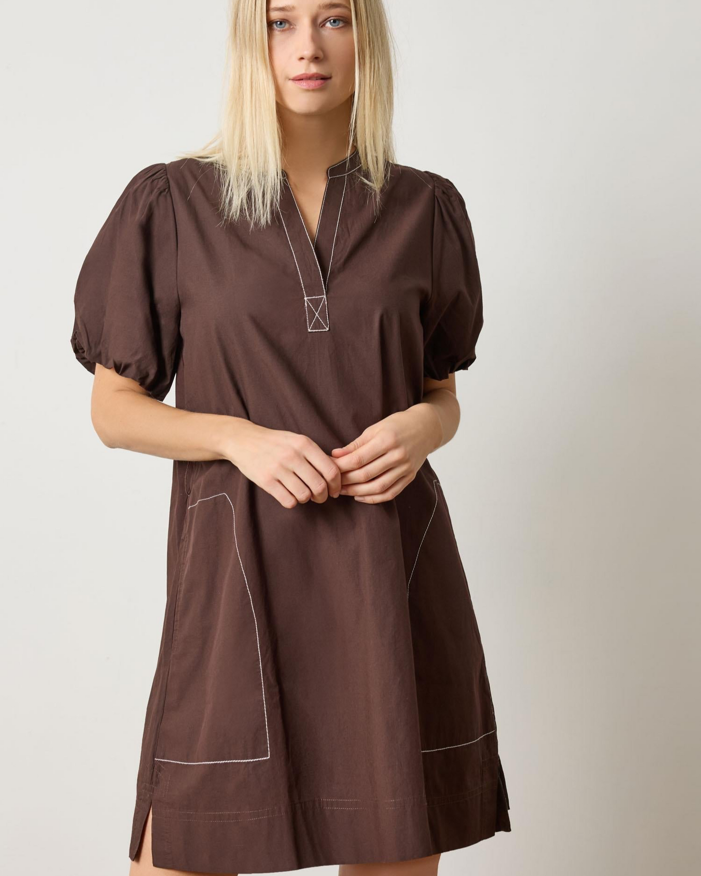 Espresso split-neck dress with puff sleeves and contrast piping seams