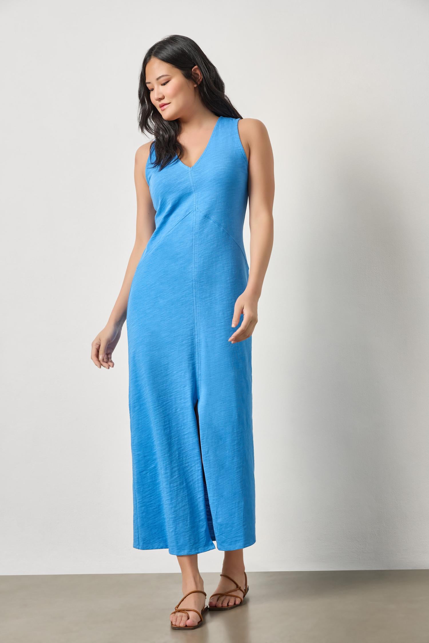 Model wearing LILLA P V-Neck Seamed Maxi Dress in blue textured knit, styled casually with sandals