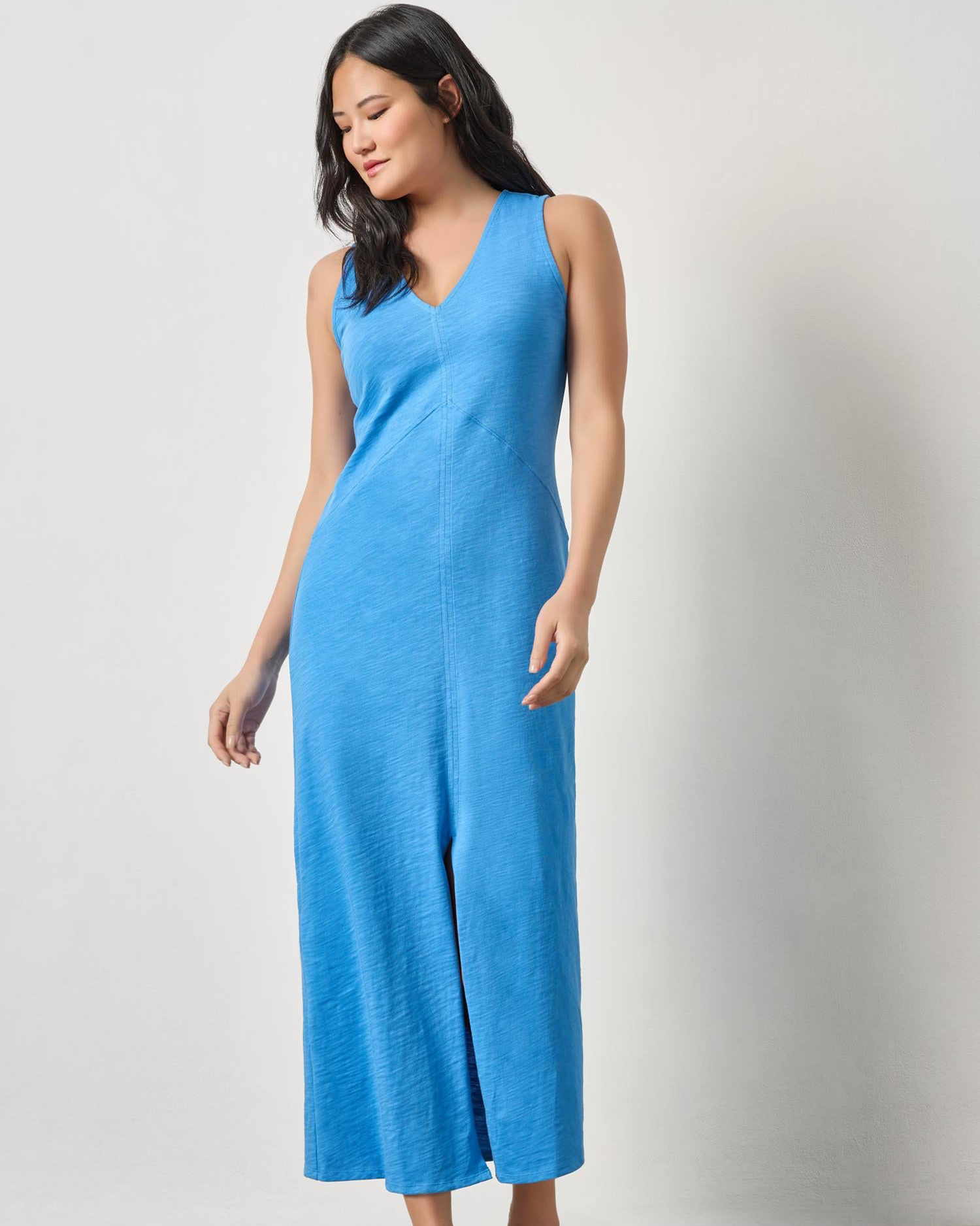Model wearing LILLA P V-Neck Seamed Maxi Dress in blue textured knit, styled casually with sandals