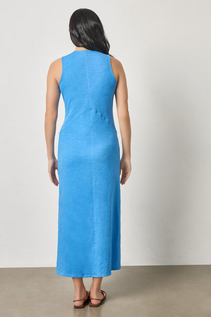 Back view of V-Neck Seamed Maxi Dress in blue textured knit styled with casual sandals