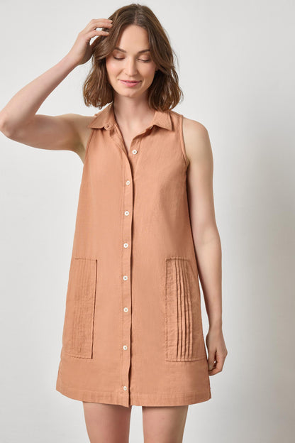Sleeveless Pleat Pocket Dress in beige textured cotton, styled with relaxed, effortless charm