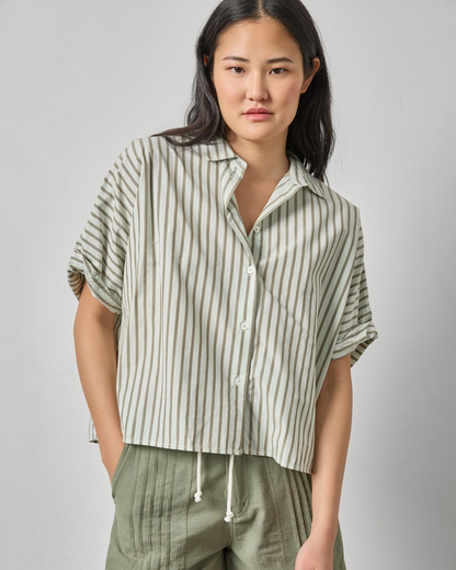 Model wearing Striped Oversized Button Down Dolman from LILLA P styled with relaxed green pants