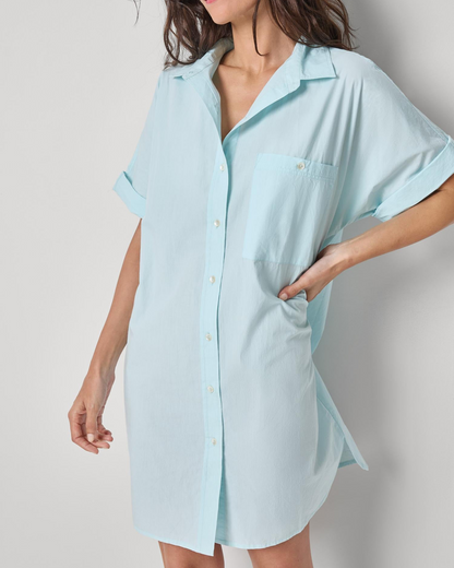 Poplin Dolman Shirt Dress in light blue woven cotton with rolled sleeves and button front