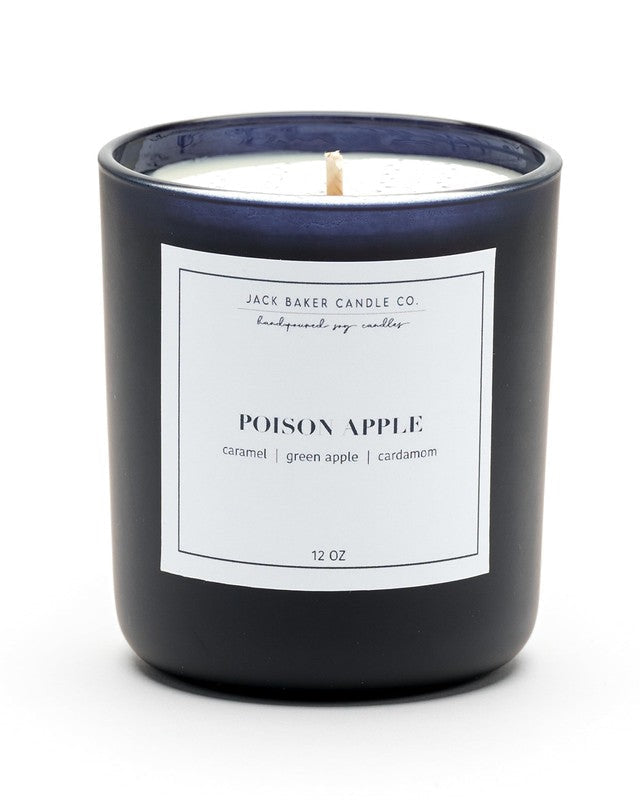 Black candle with a white label on a white background