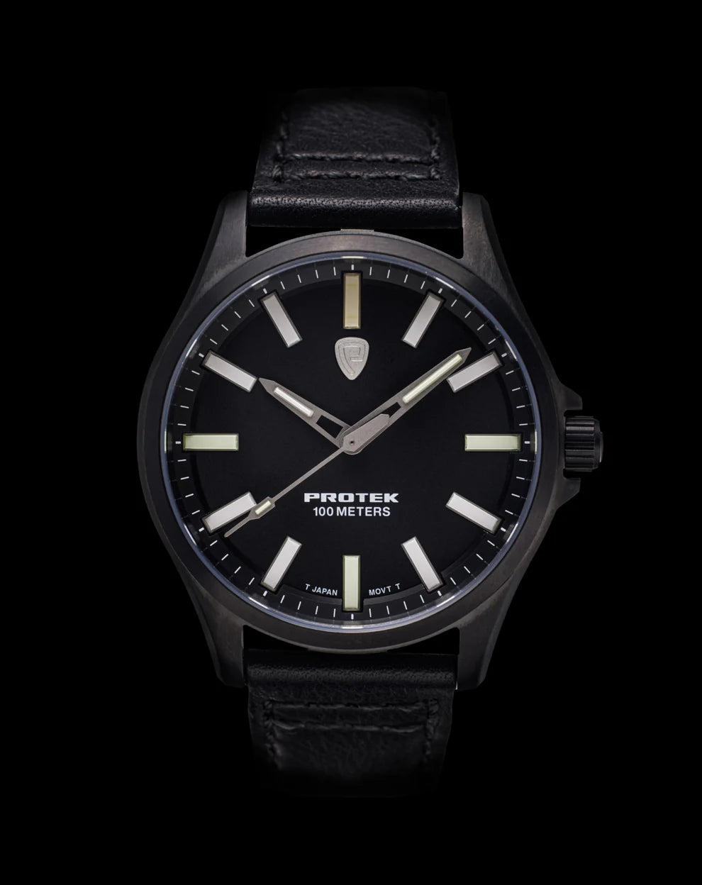 Model Pt 3002 watch with black leather strap, dark dial and tan-gold hour markers.