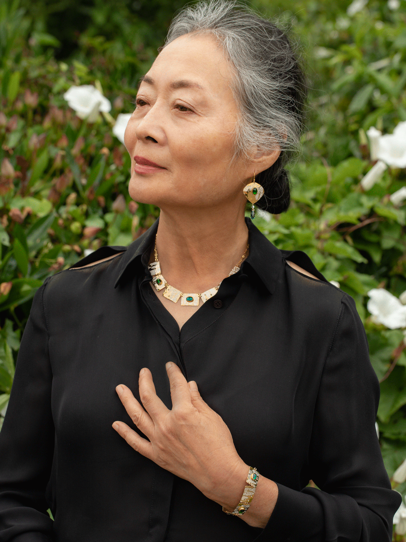 Estelle green and red artisan earrings worn with matching necklace and bracelet by HOLLY YASHI