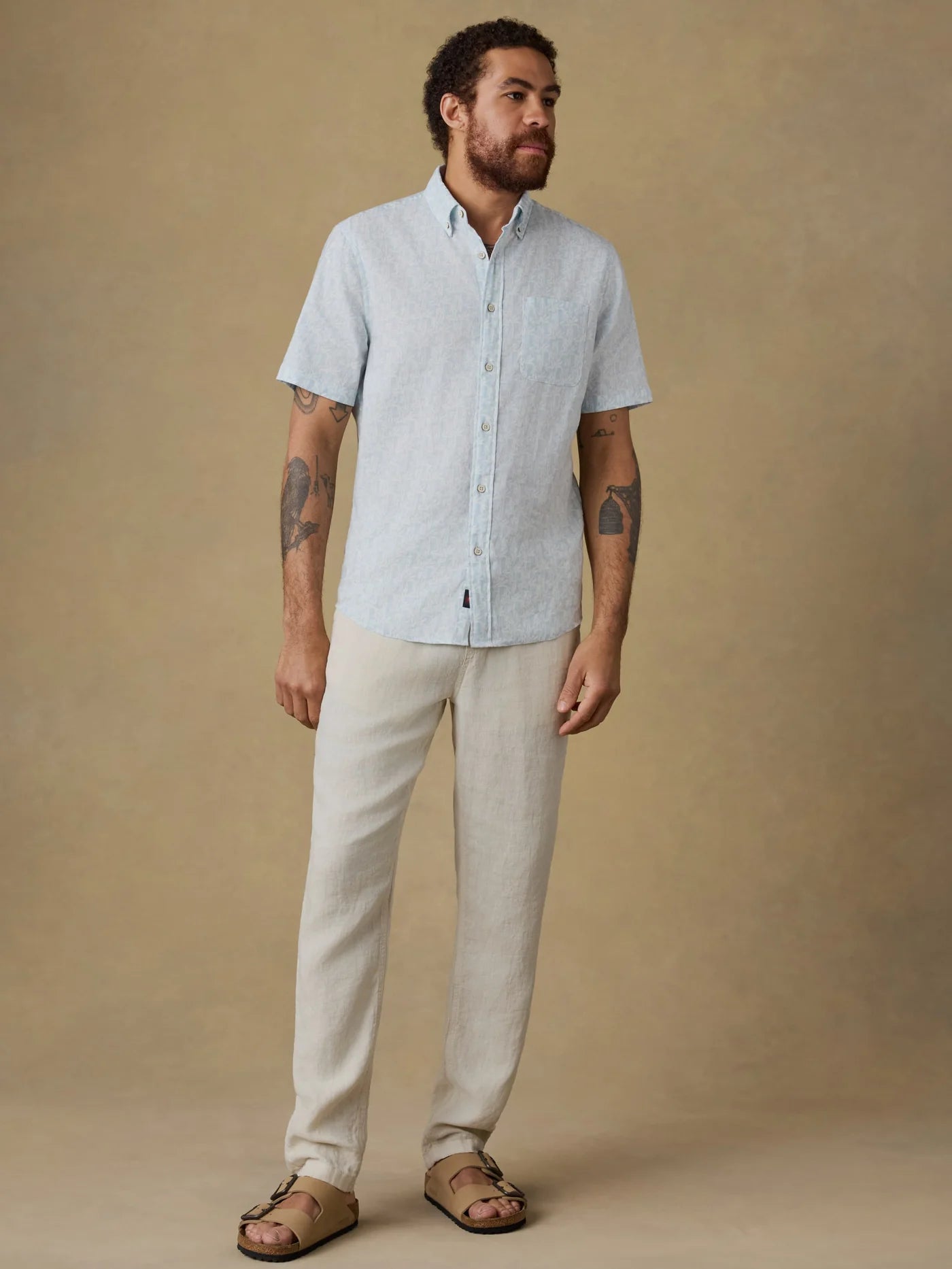 SS Breeze Shirt - Clear Sky Leaf in breathable blue linen by FAHERTY, styled with neutral pants and sandals