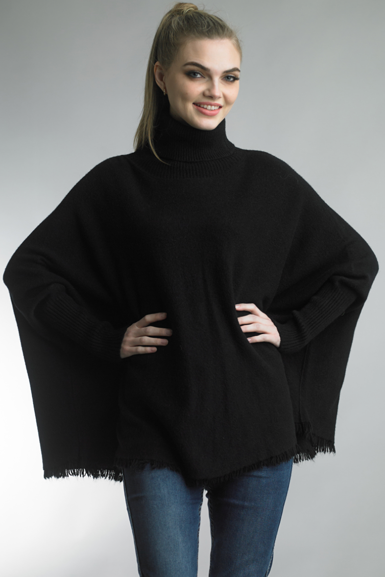 Woman wearing black Fringe Hem Tunic Sweater by TEMPO PARIS, personally curated in Fredericksburg TX