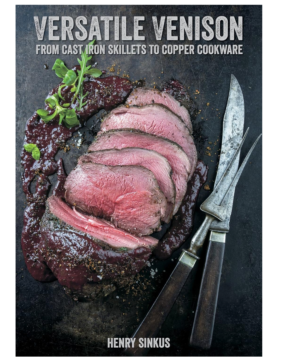 A rustic image of sliced, medium-rare venison steak on a dark surface with herbs and vintage knives, highlighting Versatile Venison with a classic, hearty presentation.