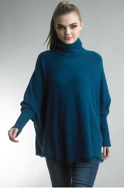 Woman wearing black Fringe Hem Tunic Sweater by TEMPO PARIS, personally curated in Fredericksburg TX