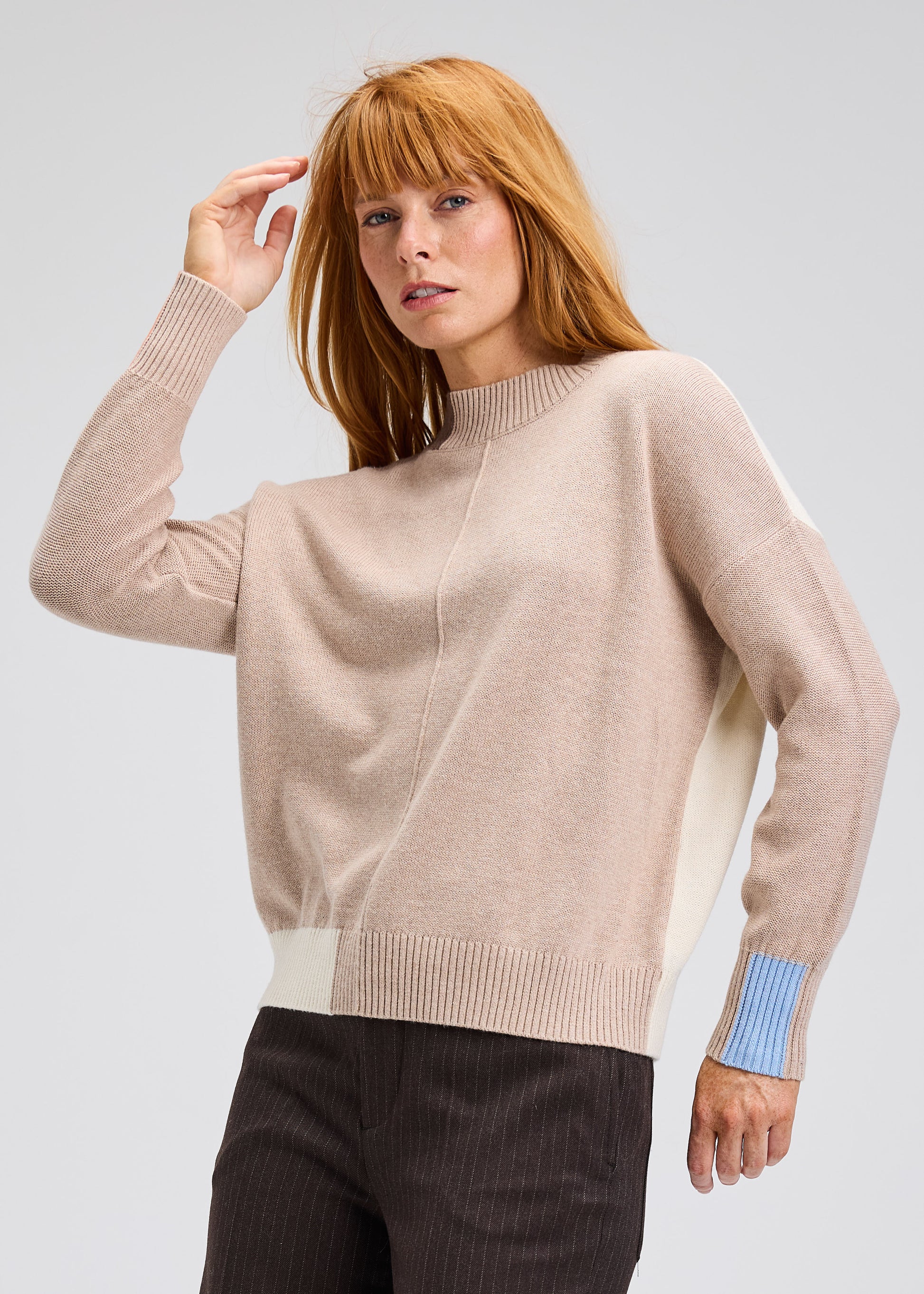 Oat color block trim sweater with mock neck and striped blue cuff detail