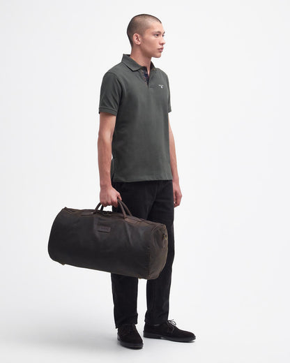 Wax Holdall in brown and green waxed cotton with leather trims, BARBOUR INC., Bags collection
