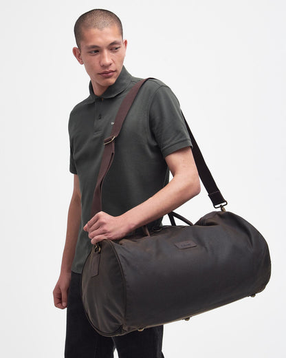 Wax Holdall in brown and green waxed cotton with leather trims, BARBOUR INC., Bags collection