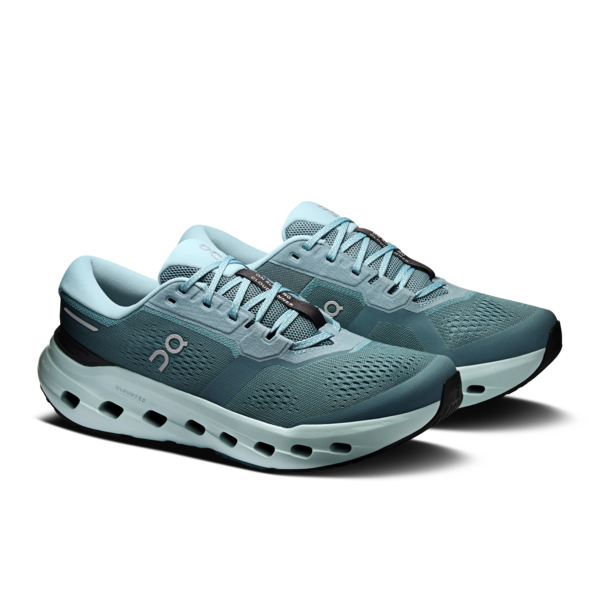 Pair of teal athletic running shoes with cushioned soles