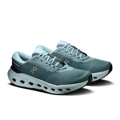 Pair of teal athletic running shoes with cushioned soles