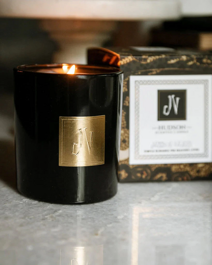 Hudson Candle in black glass with gold emblem, lit by JACKSON VAUGHN, Candles HCO collection