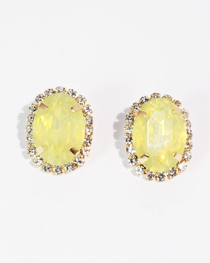The Golden Glow Studs with luminous yellow oval gemstones and crystal accents by TREASURE JEWELS