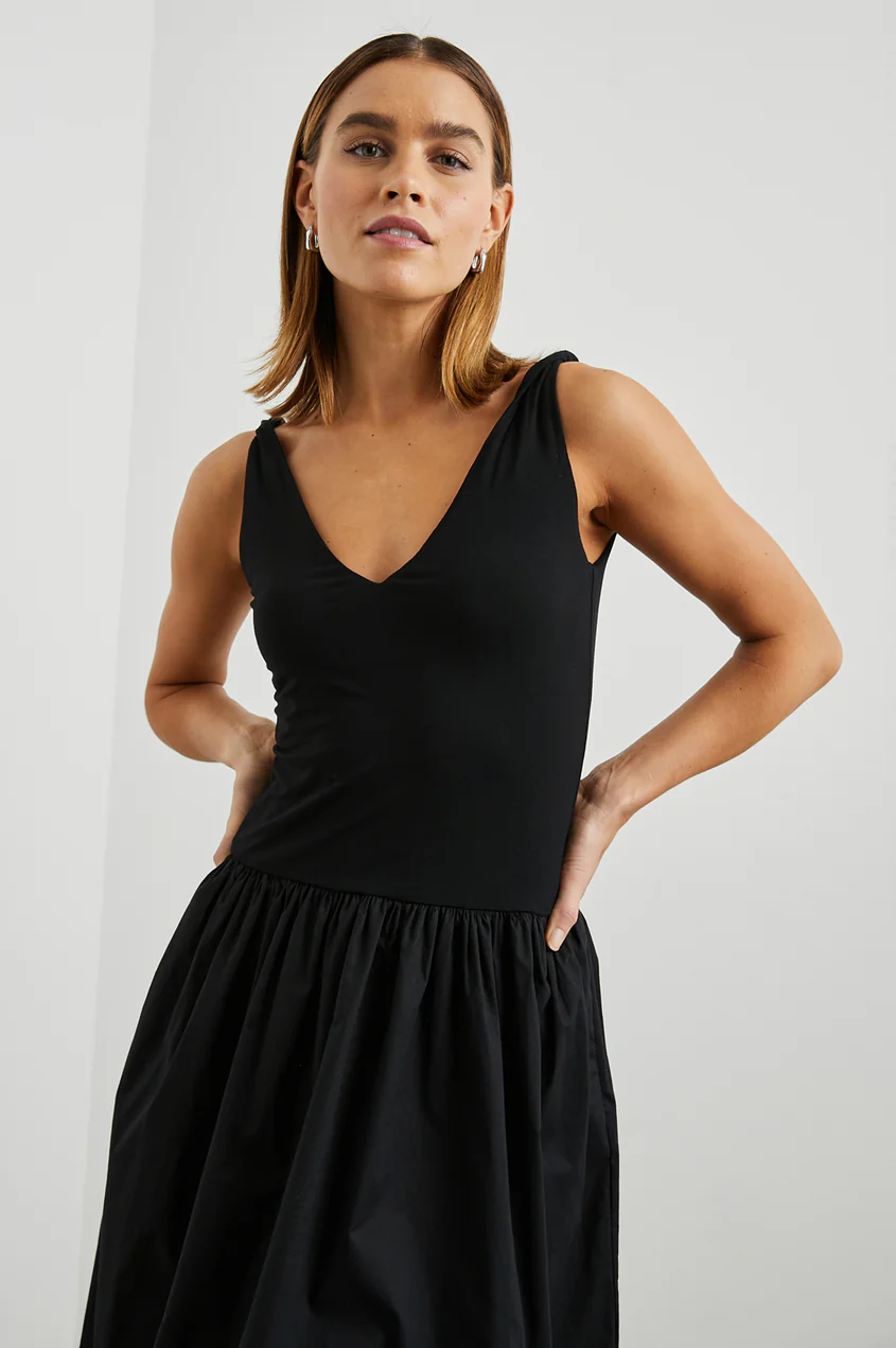 Black sleeveless V-neck dress with gathered waist detail and full skirt
